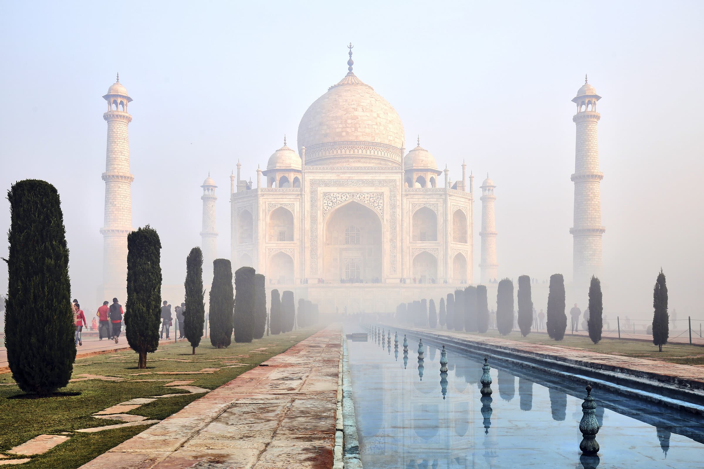 Taj Mahal at sunrise through morning mist